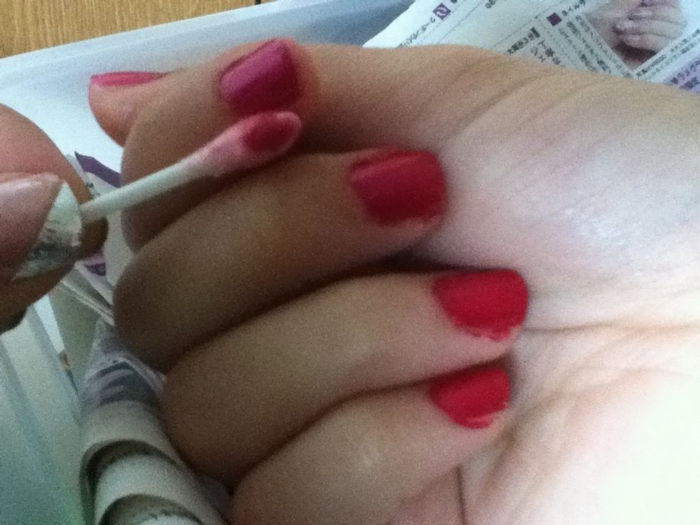 You can clean off the nail polish that got on your fingers by using nail polish remover and a q-tip.