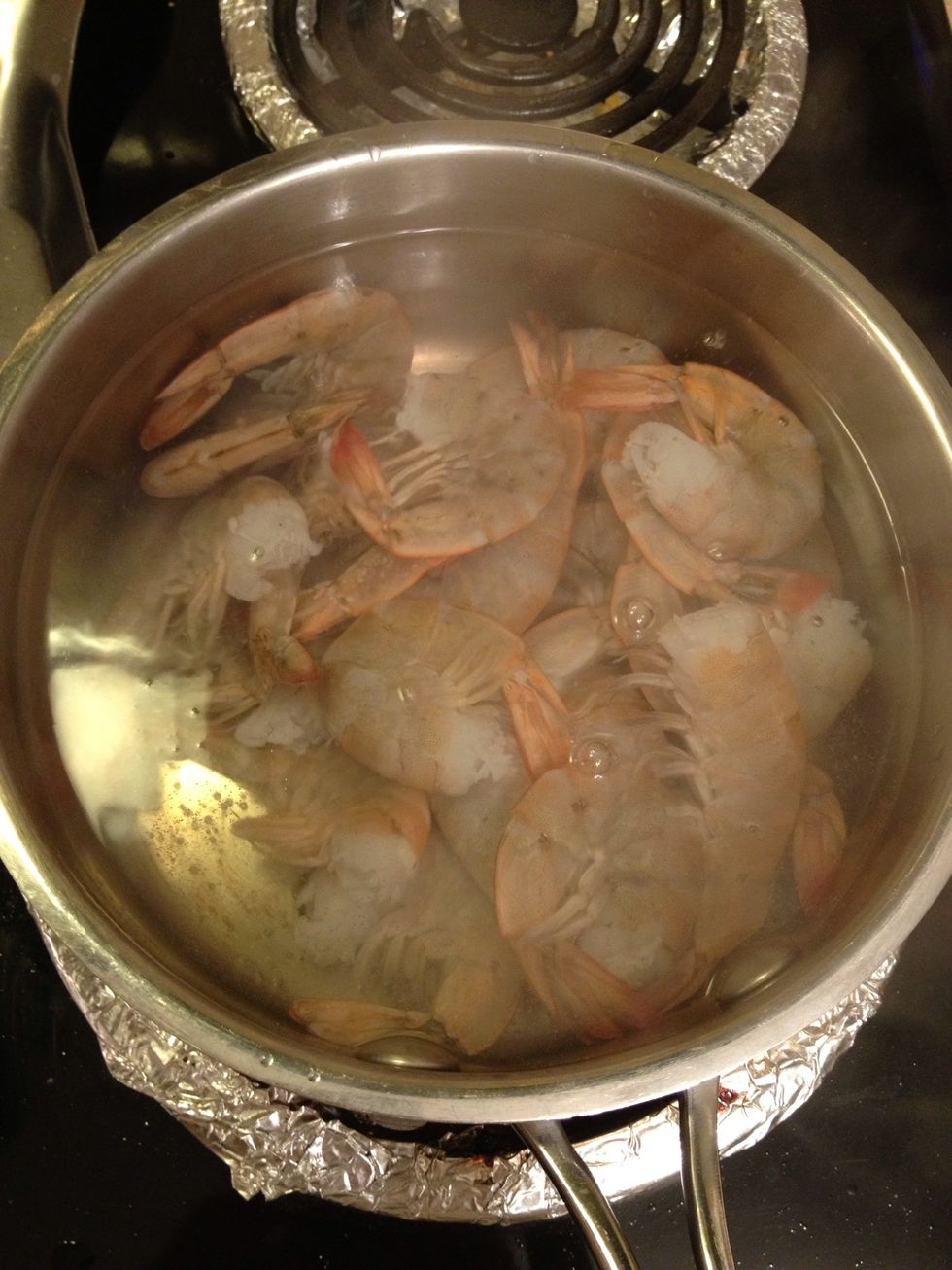 You can cook until they have changed color to bright orange and they will curl up.