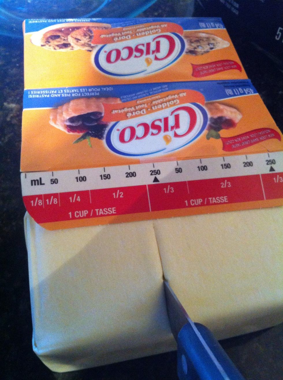 You can cut right through the shortening paper which makes it less messy when transferring it into the bowl.