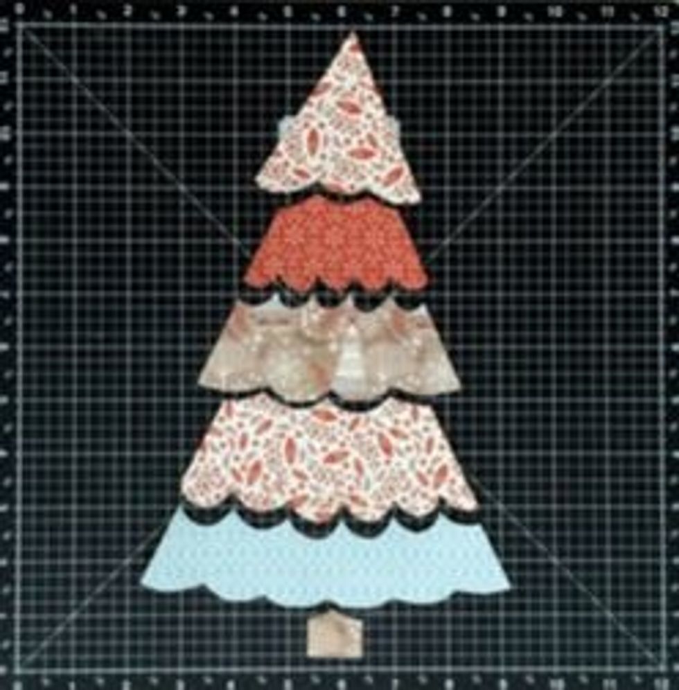 You can cut the tree sections straight or scalloped. The scallops do not need to be evenly spaced out. It is supposed to be whimsical. You can use the pattern to trace the tree sections if you wish!