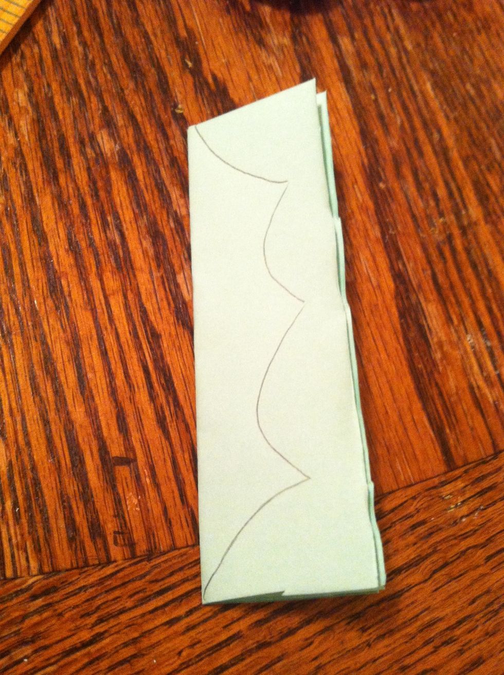 You can draw a guide line for your leaves, or just free hand it. I drew it on for this guide so you can see it. A holly leaf is basically just a long pointed leaf, you can trim it down after..