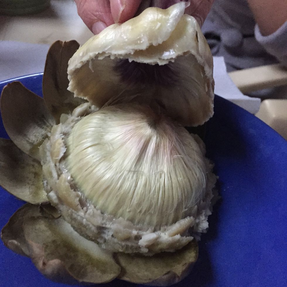 You can eat them after dipping the tips in the sauce by crunching the end.