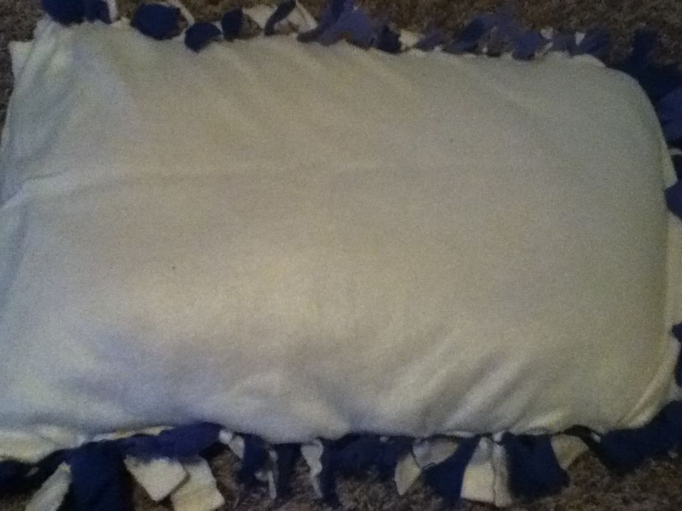 You can ether tie up the other end or you can tuck in the flaps. I like to leave mine open in case I want to change it.