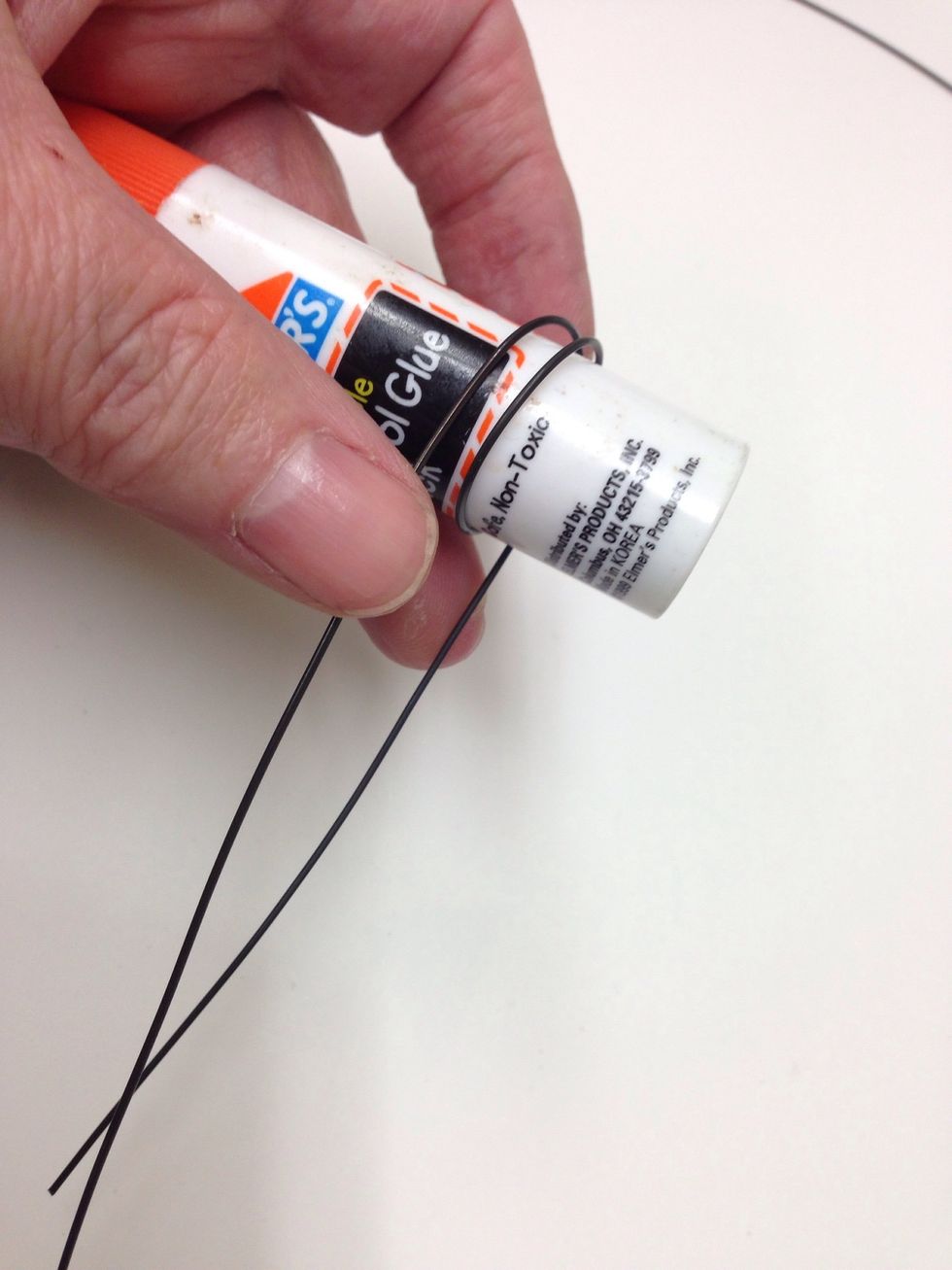 You can form a smaller loop by wrapping the wire in the same way around your glue stick container.