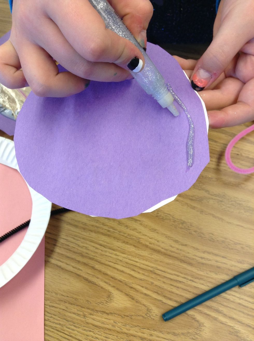 You can get your colored paper to match, and cut it around the big circle.