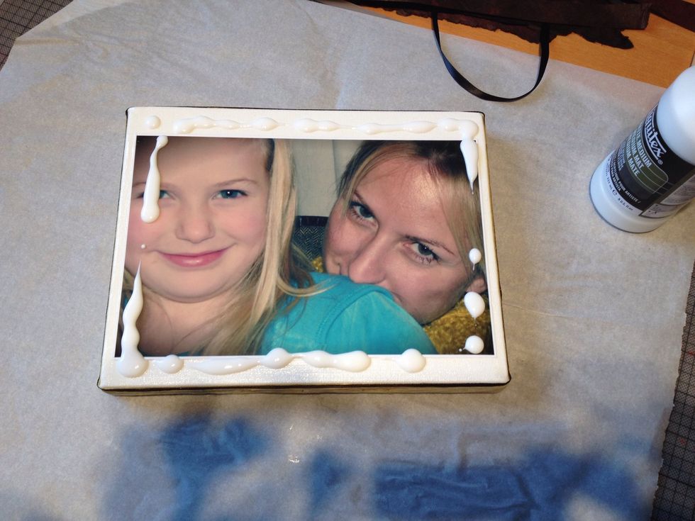 You can lay your project on wax paper so that it doesn't stick to your work space while drying.