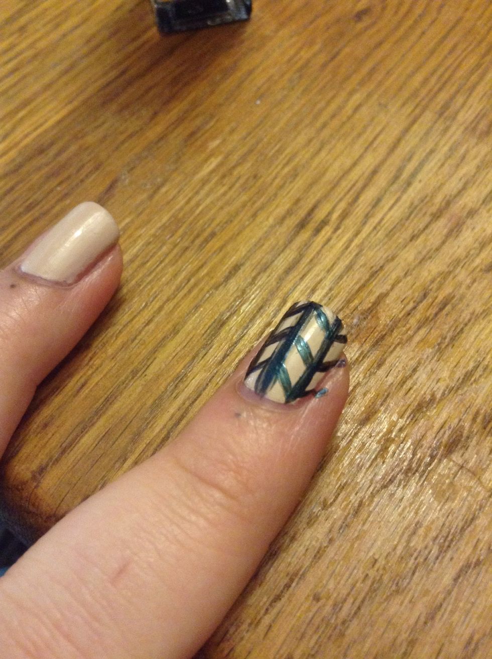 You can leave it like a bar across your nail, or do the sides and cover it completely.