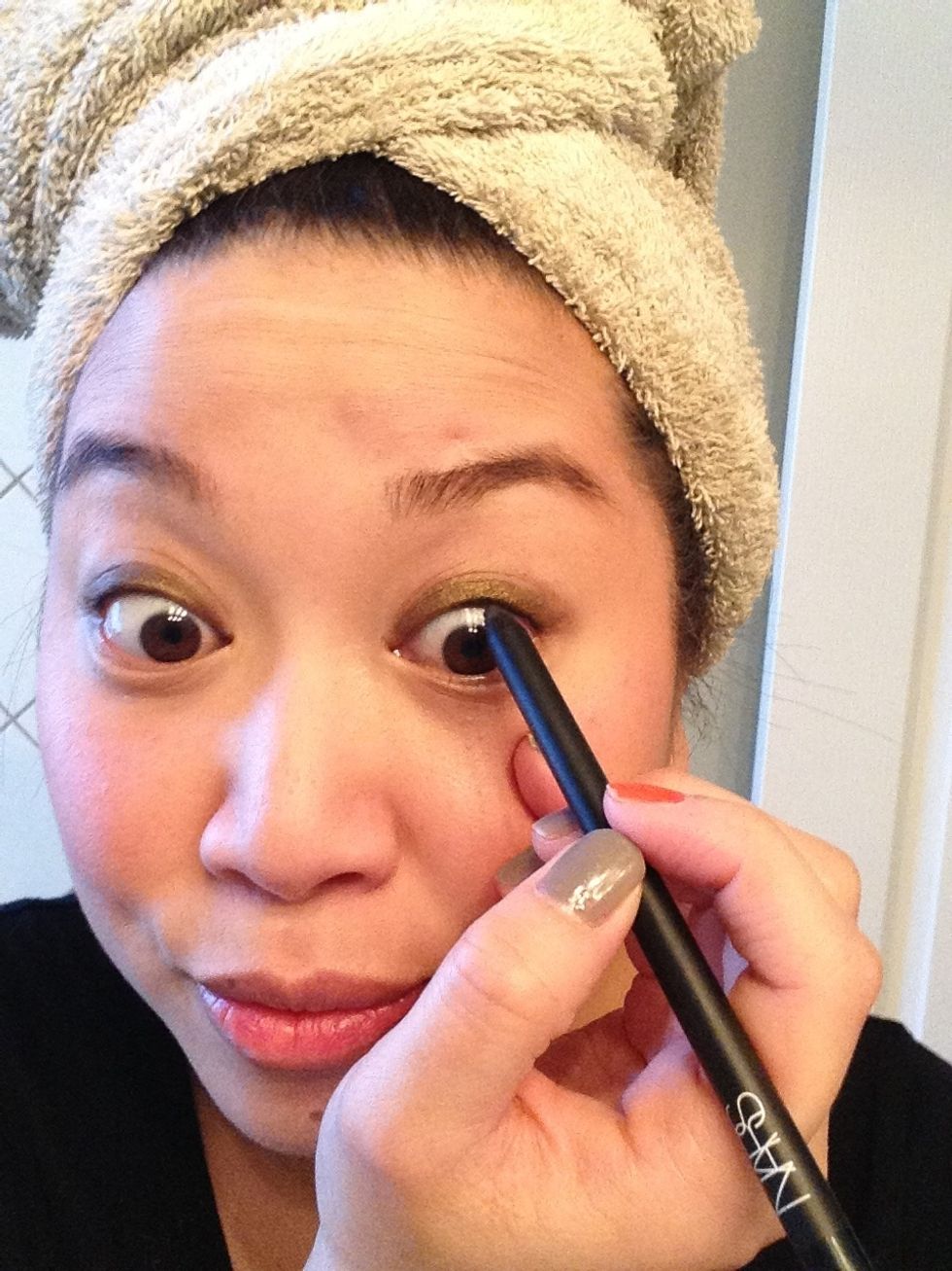You can line the inner rim with black liner for more definition and go ahead and put on your mascara ...