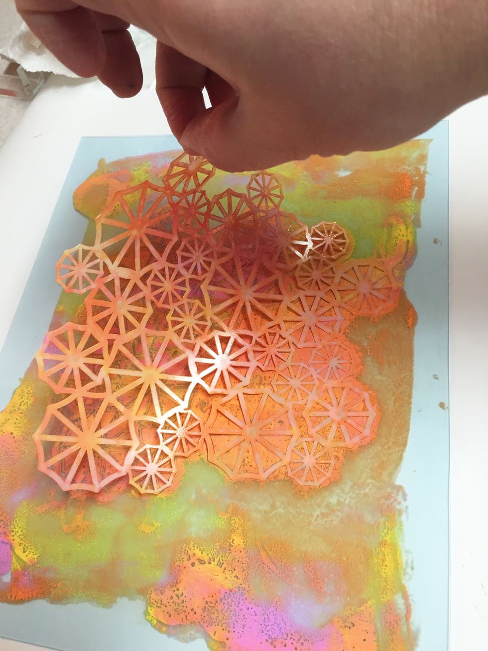 you can make a second print, called a "ghost print" from the same plate. first carefully remove the stencil.