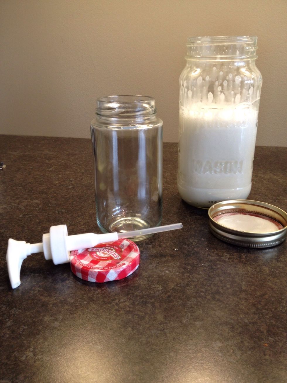 You can make a soap pump dispenser out of an old jam jar. Just drill a hole in the lid, large enough to fit a pump from an old dispenser, and glue the pump in place.  Let the glue dry before using.