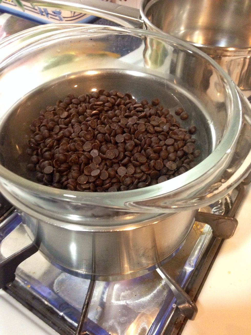 You can melt the chocolate in the microwave but I have melted the chips over boiling water.