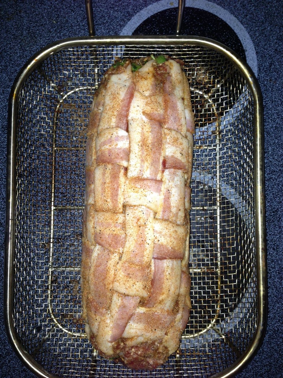 You can place it right onto your grill rack but I prefer to use a mesh tray Ike this one.   Put some rub all over before you begin smoking.