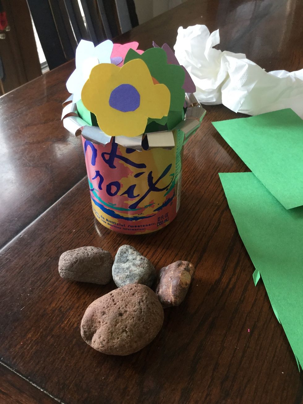 You can put rocks on the bottom to make sure it doesn't fall over