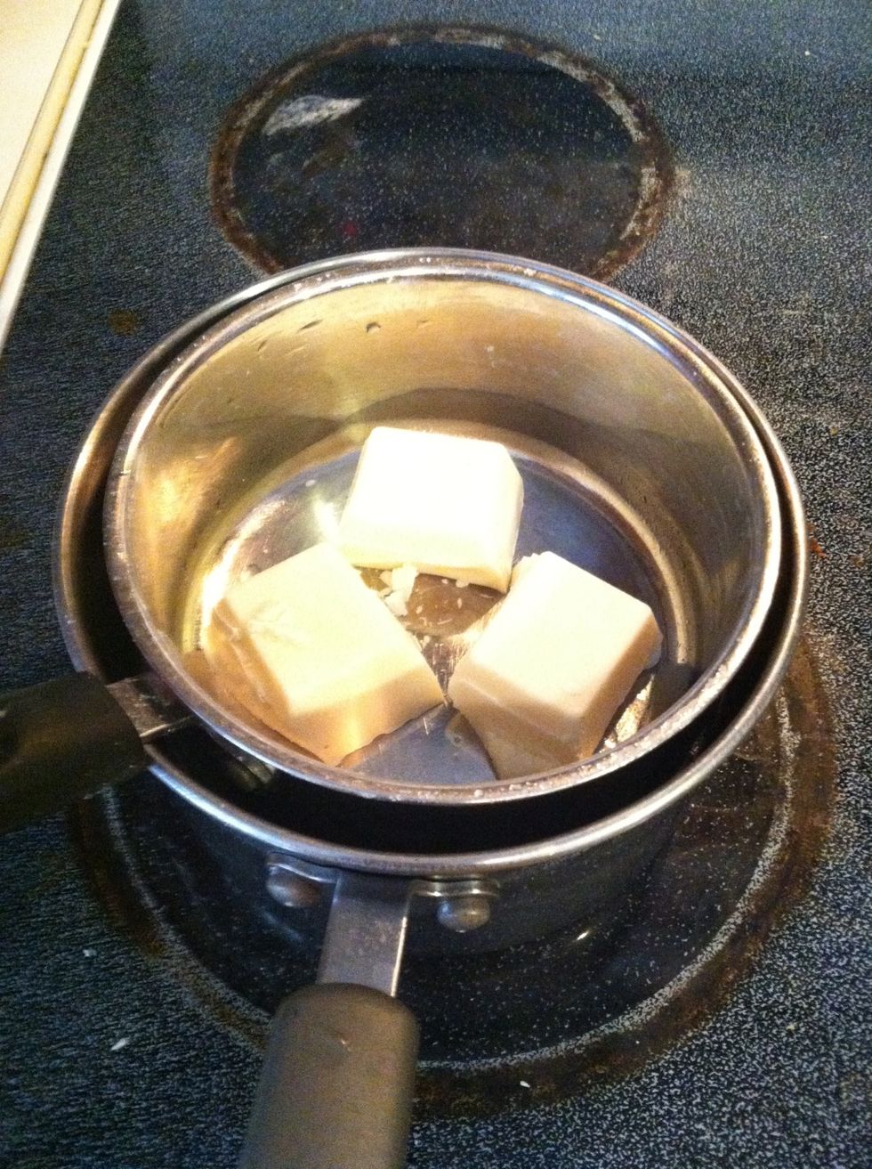 You can put the whole bar in or cut it up...I cut it up because I believe it melts faster You can use as much as u want depending on how sweet you want the popcorn