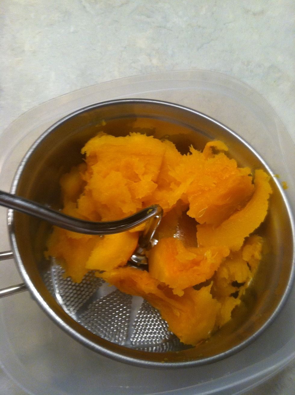 You can put your pumpkin through a strainer, but I suggest putting the flesh in the blender with some milk.
