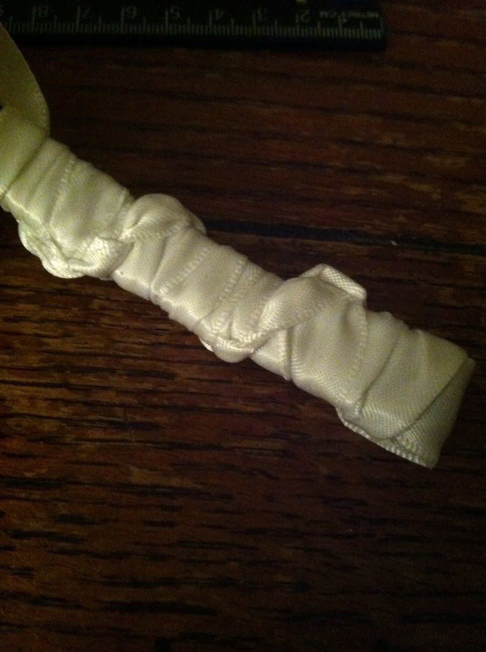 You can save ribbon by making the stitches on the back looser. It'll look like this.