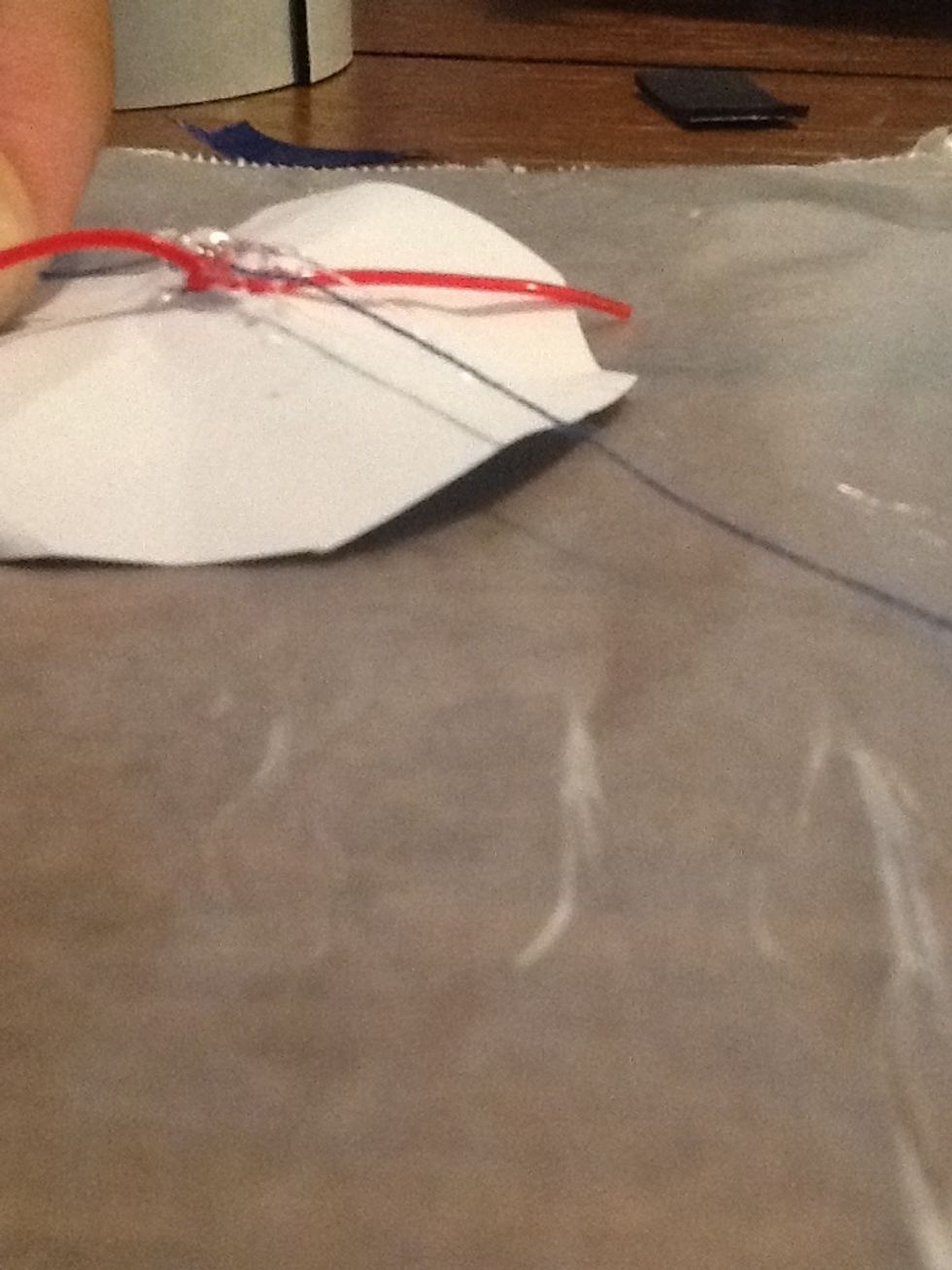 You can see I'm pushing the thread in to the bit of glue I put down