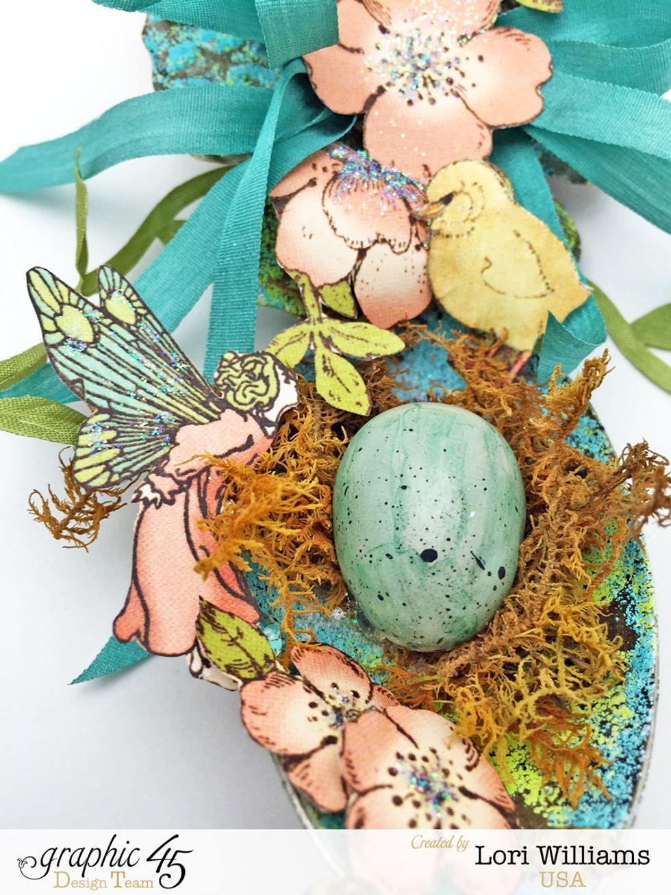 You can see some of the detail work of the fussy cutting and the glitter that has been added.