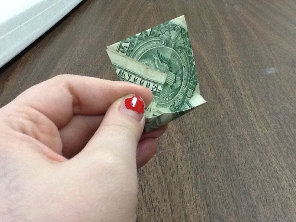 You can see that there's a small pocket that you've created. Also there's a crease near the bottom, from where it was folded under. Don't straighten it out. Again, be careful not pull out too much.