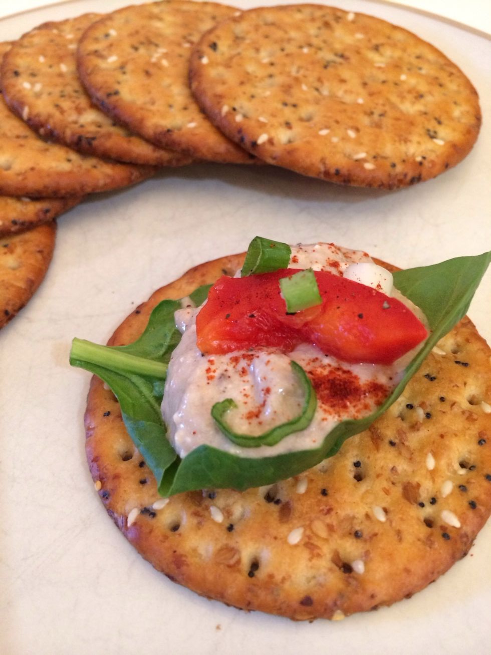 You can serve this in many different ways. I layered spinach, p\u00e2t\u00e9, red bell pepper and scallions on a cracker, dusted with paprika. Leave a comment & let me know how you utilized this delicious dish!