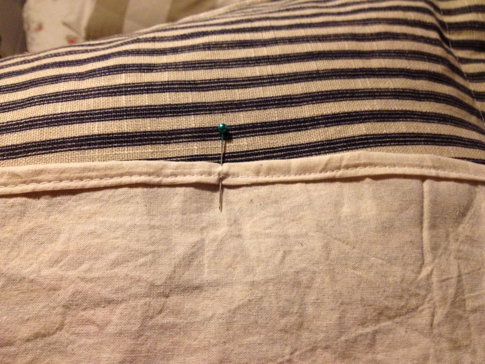 You can sew over your pins providing you sew across them, the needle will just glide off the pins.