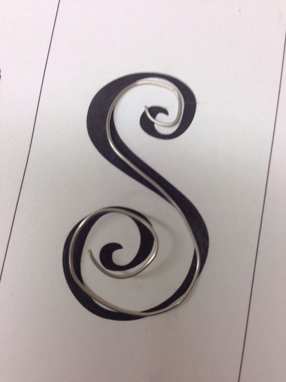 You can shape a curve on the bottom section of the hanger like you did using the pen on the top section of the hanger.