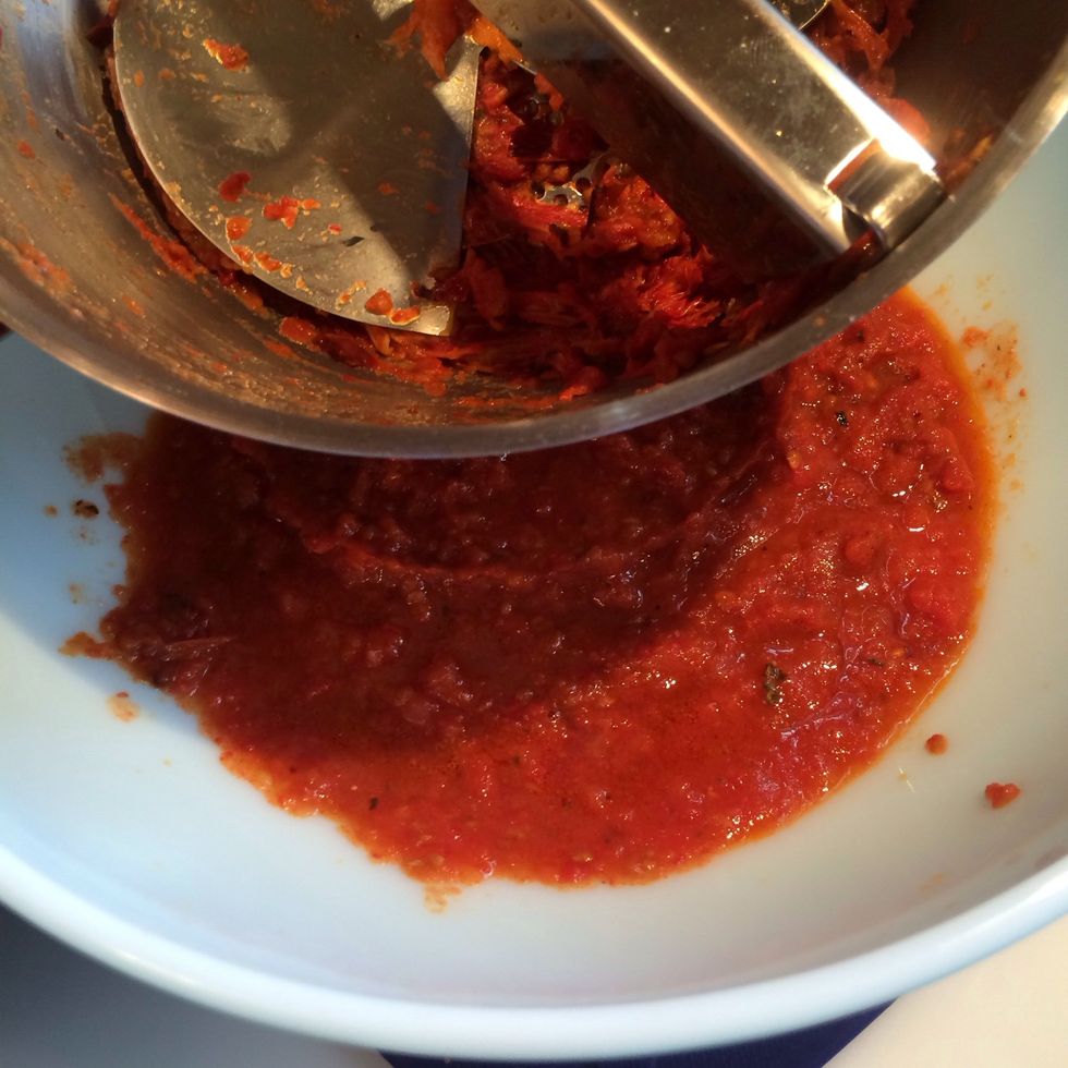 You can skip this part if you like. Later, the emmersion blender will pur\u00e9e the soup but won't totally pur\u00e9e the tough tomato skins. The tomato skins can be tossed away. Set the tomato sauce aside.
