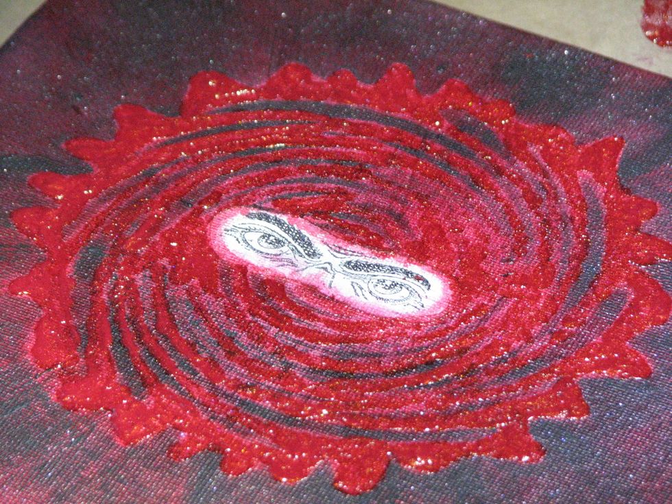 You can somewhat see the dimension the paint lends to the canvas in this photo.  Let it dry completely before moving to the next step.