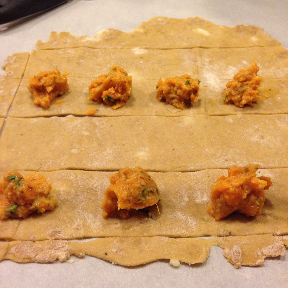 You can space the filling as close or far as you want, all depends on how large of a ravioli you want, and how much filling! 1 TBSP in a 2"x2" square gives you a good pasta to filling ratio.