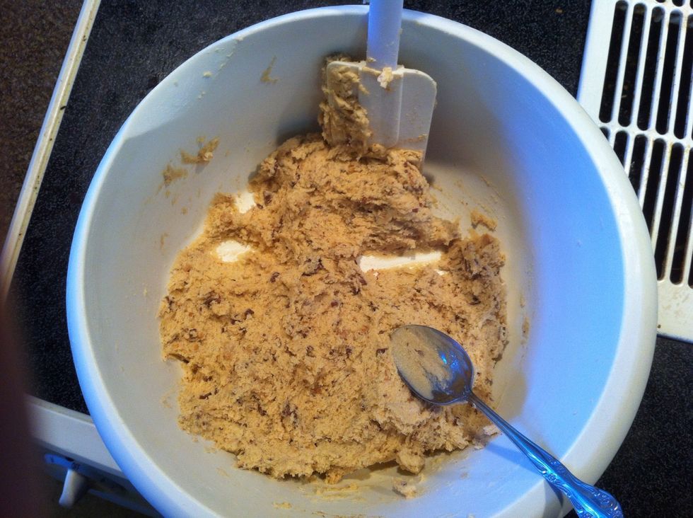 You can't really see them.... But nows the time to add your candy pieces. The combination of addins could be endless \ud83d\ude1d But I just added Heath Toffee bits. Use a teaspoon to make little cookie balls