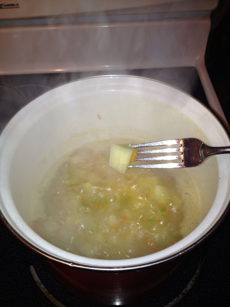 You can test it with the fork. You want the fork to glide smoothly into the potato.