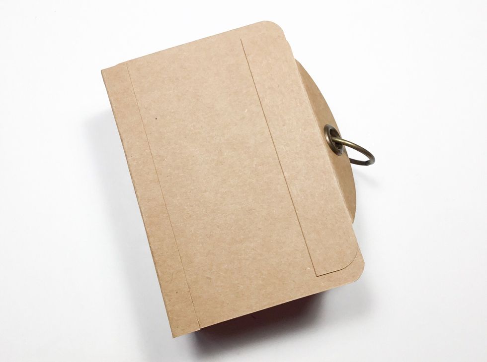 You can use a small binder ring to hold the album closed.