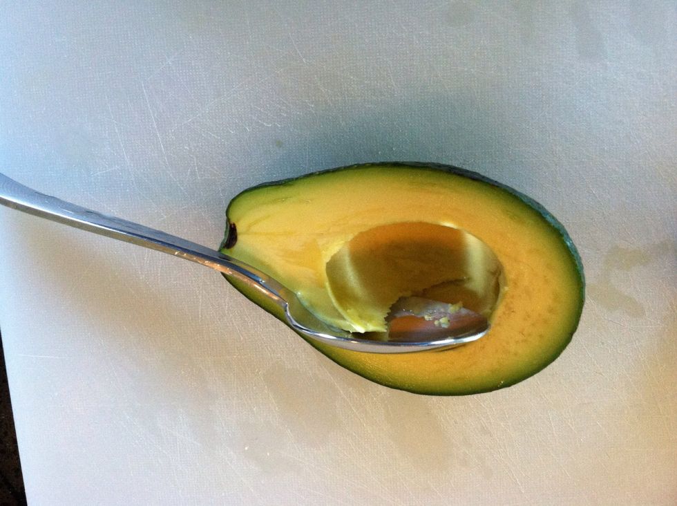 You can use a spoon to scoop out the avocado if the peel sticks.