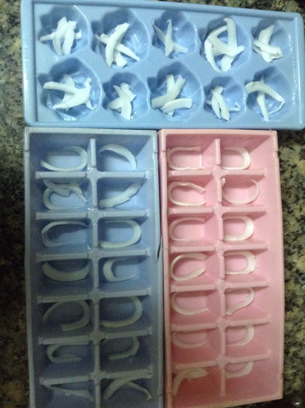 You can use any mold you like, here I already had some ice tray so I'll use it. Place some coconut meat first.
