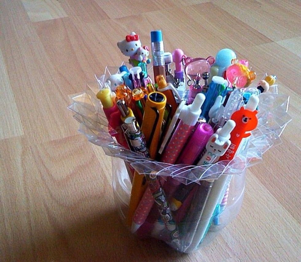 You can use plastic bottles...notice in this one I cut the strips only about half way down the bottle.