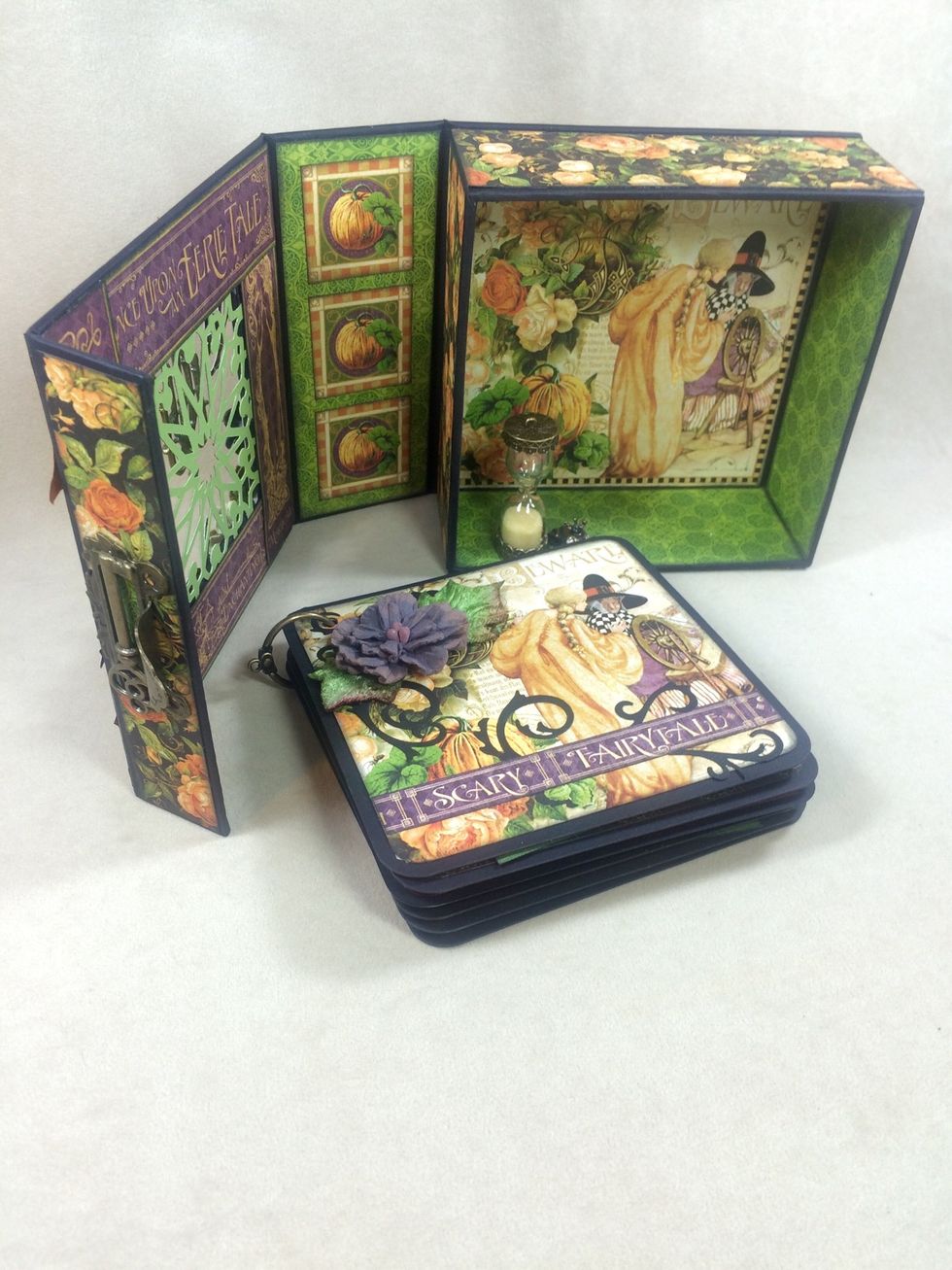 You can use the six black cardstock squares to create a mini album to fit in your mixed media box.