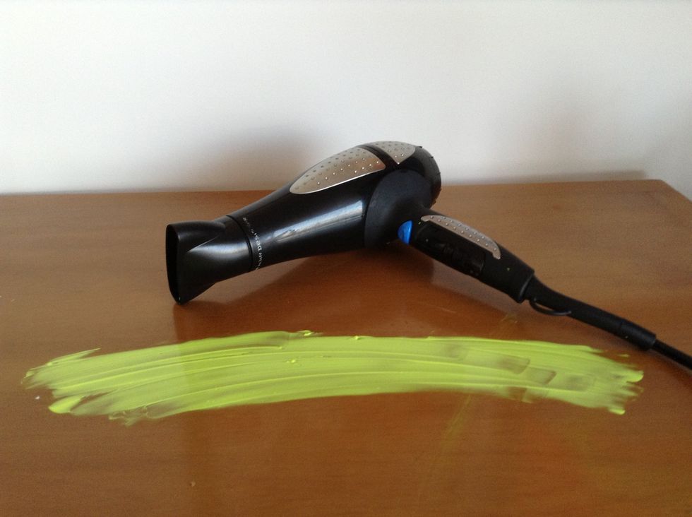 You can wait for it to dry or you can use a hair dryer.