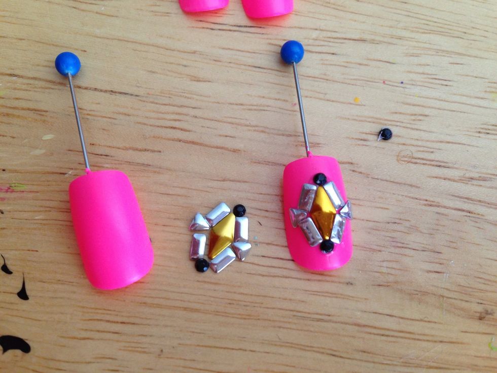 You can work out your designs before you glue them on. I put a dab of Precise glue and place bling on with toothpicks.