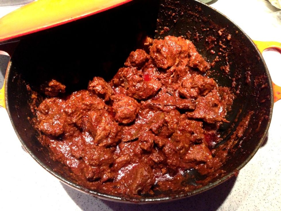 You'd know the stew is ready when the colour turned dark brown and chili oil appears on the surface. Remove from stove and place the pot aside.