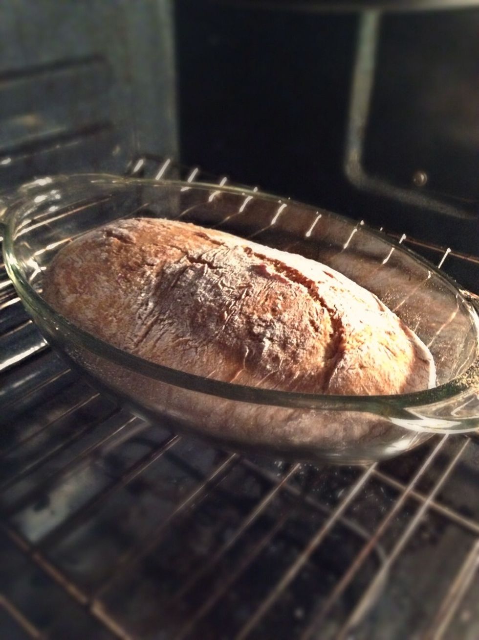 You don't have to watch the time if you're using a dish with a glass lid. Once the bread cracks and the edges are turning golden, it's time to take off the lid.