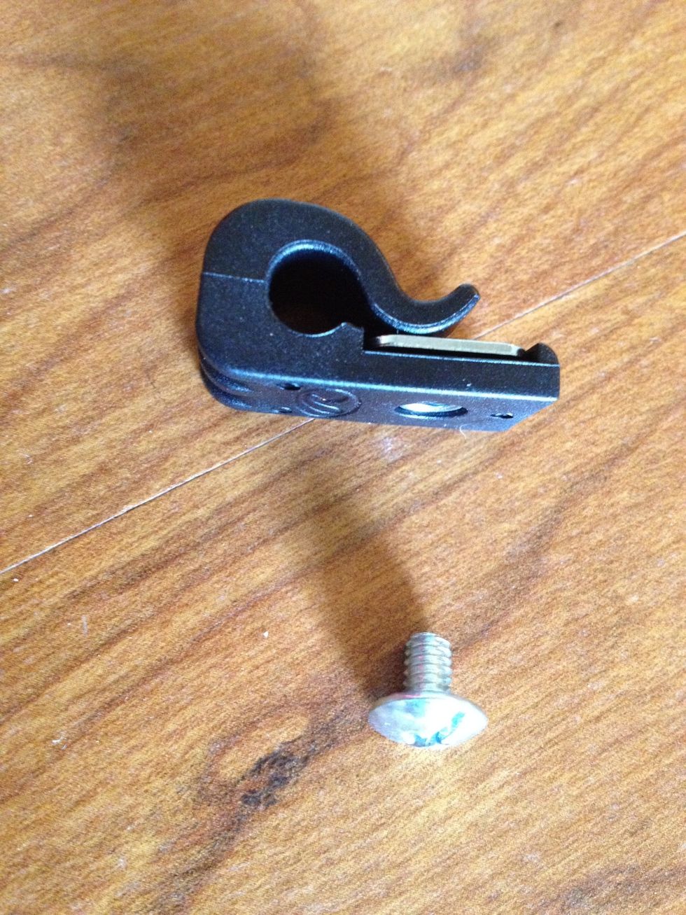 You don't need a screw driver. The screw is inserted on the inside of the helmet and the clip rotates around on the outside until it becomes snug.