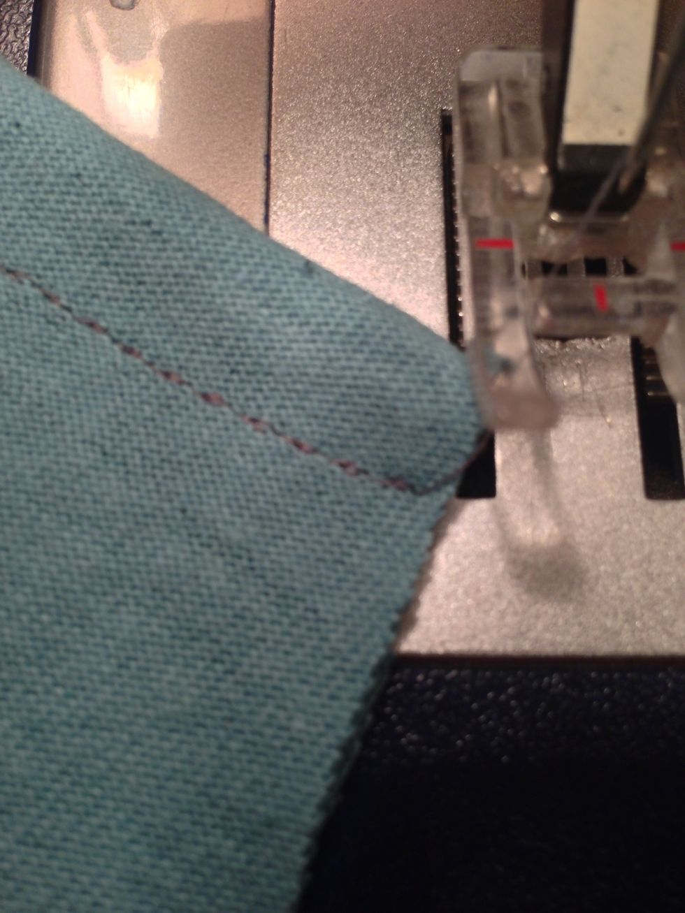 You don't need to back-tack a stretch straight stitch.