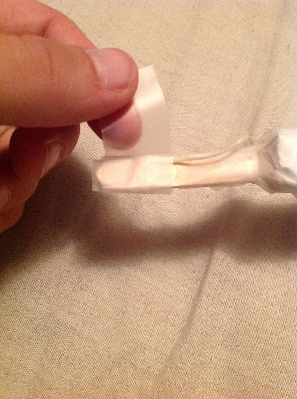 You don't want the twine moving all around so you need to tape it down.