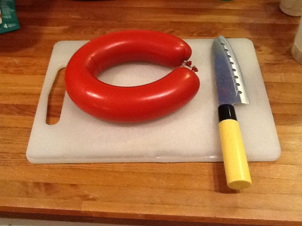 You first need a knife and a big sausage