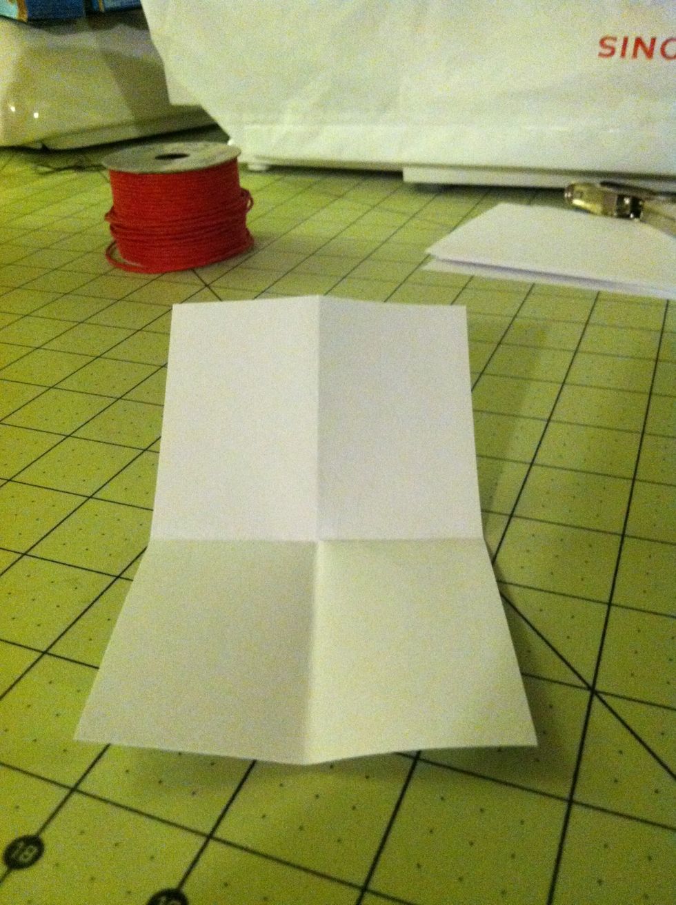 You get four tags out of every card, so fold your card in quarters like this.