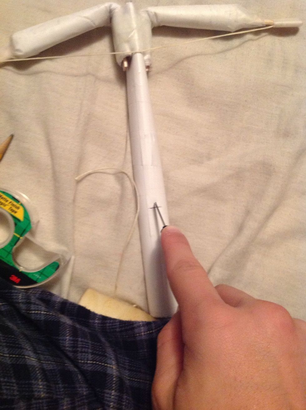 You got to make a hole for the trigger so take a sharp object or a box cutter and start cutting through the main body of the crossbow.