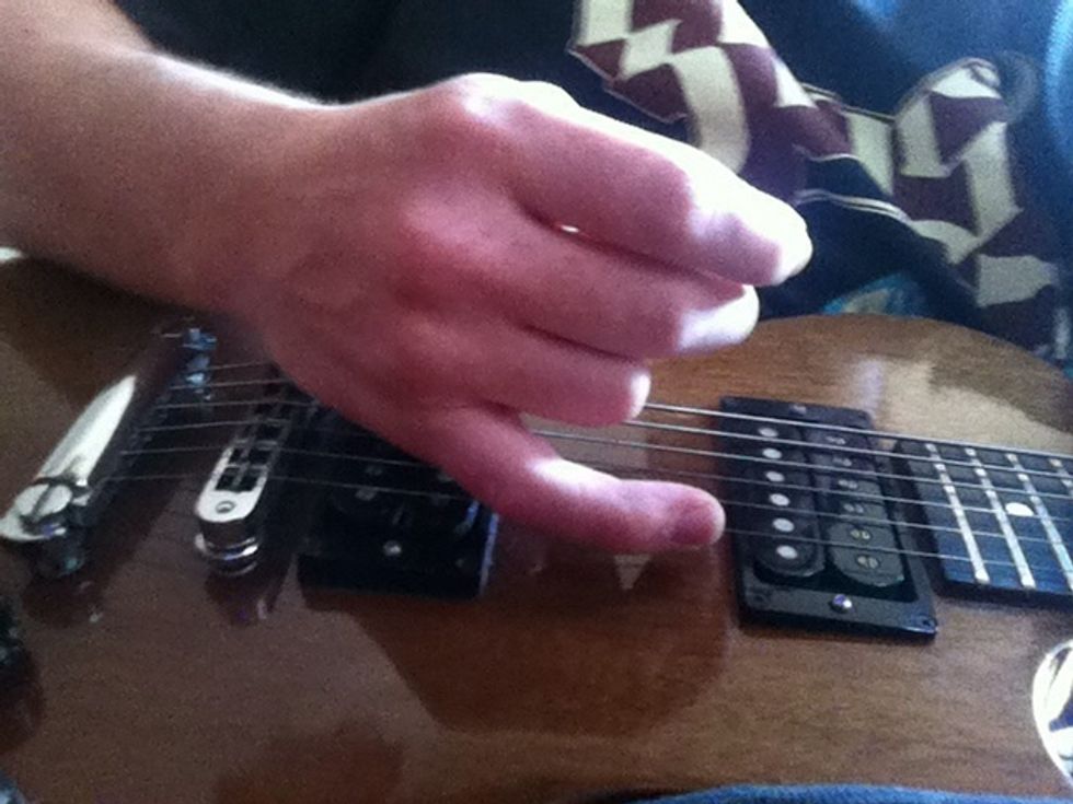 you gotta learn to palm mute. do this by putting your palm right where your strings meet your bridge. your hand actually goes on the strings to mute them and make them sound disgusting. see next step