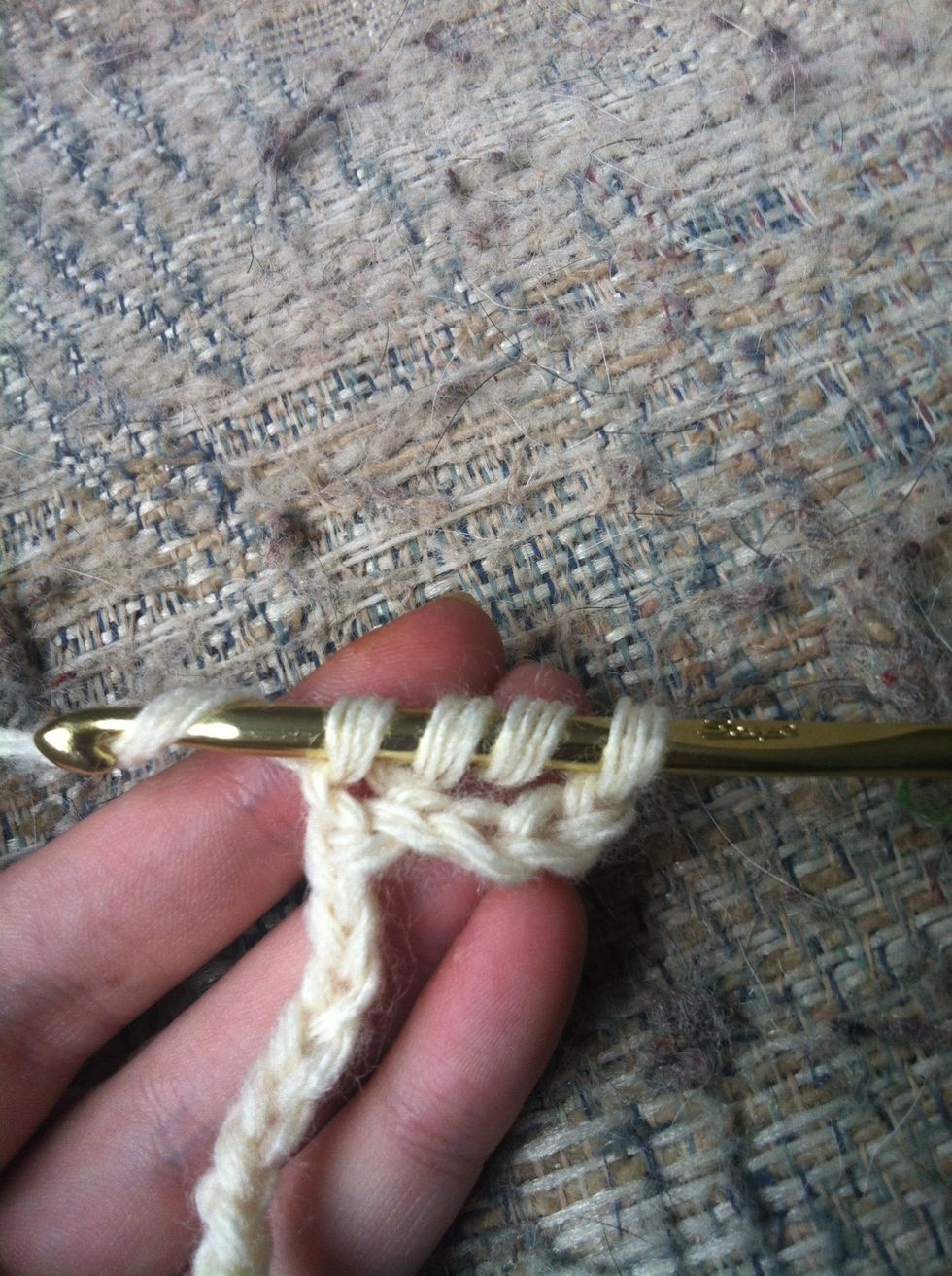 you have 4 loops on your hook. yarn around and pull trough the first 2 loops