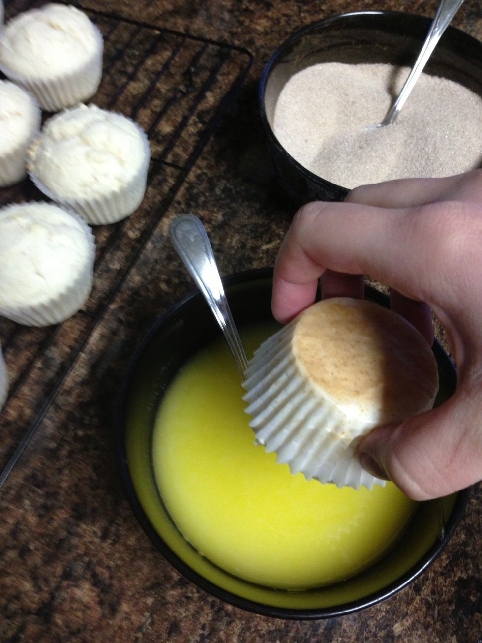 You have a choice to skip out on the paper muffin cups and coat your entire muffin with the coating, but I chose to coat only the muffin top for a not-as-sweet alternative. Dip the muffin in butter.