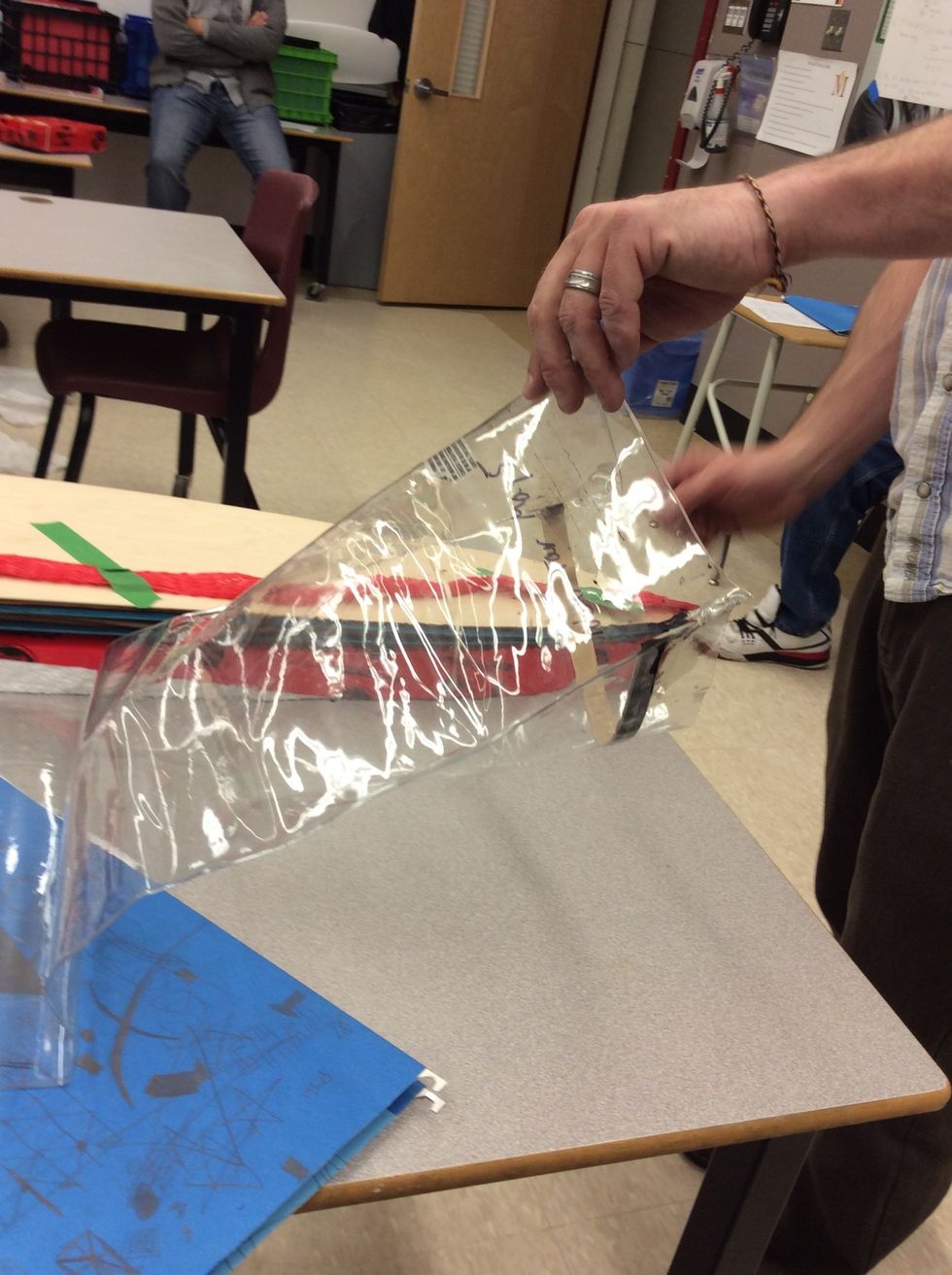 You have to have someone to hold open the bag and another person put the bored into the bag. It's a two man job.